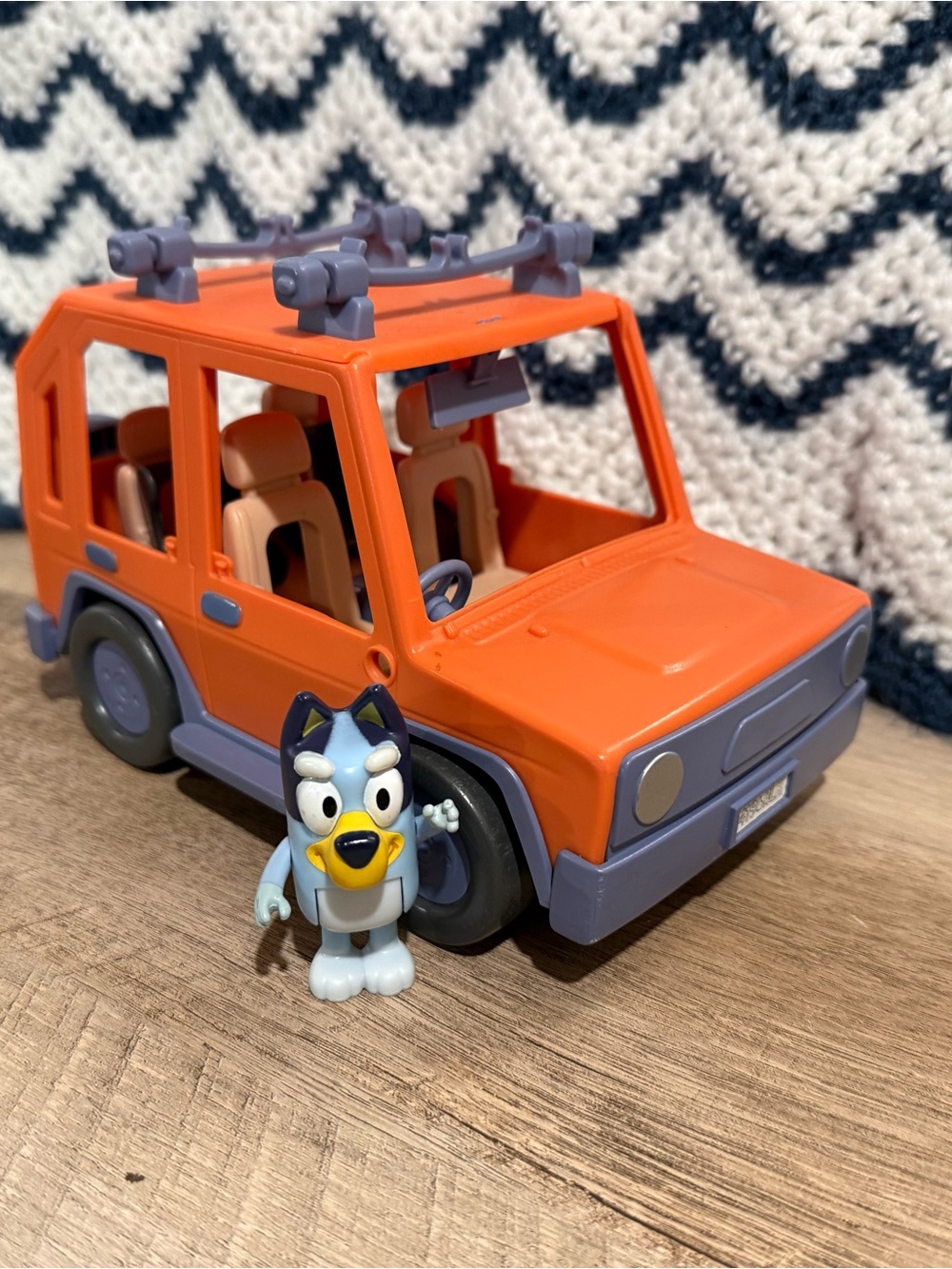 Orange Toy SUV Play Vehicle with Light Blue Figurine
